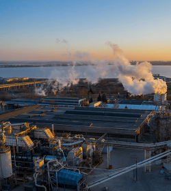 Chimney in a timber production facility at sunset. Burgas, Bulgaria (C) Shutterstock, Niki Spasov